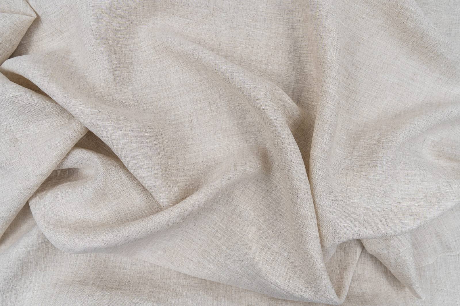 Close-up of soft cream linen fabric